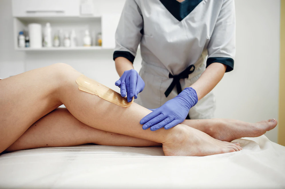 Skin depilation being done on a woman